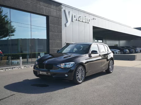 BMW 114i 5-deurs Navigatie Parkeerhulp Lederen interieur Open dak Cruise control Airconditioning volledig groot onderhoud gehad!
